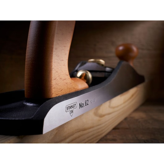 Close-up photo of STANLEY 1-12-137 hand plane with wooden handles on a wood surface.
