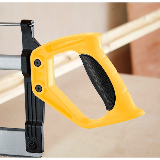 STANLEY 1-20-800 hacksaw handle in yellow and black, close-up side angle, visible textured grip.