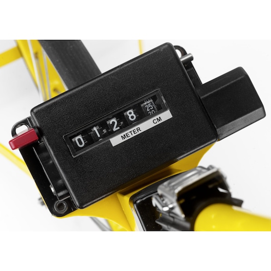 STANLEY 1-77-109 photography of close-up black meter counter on yellow measuring wheel, angled view.