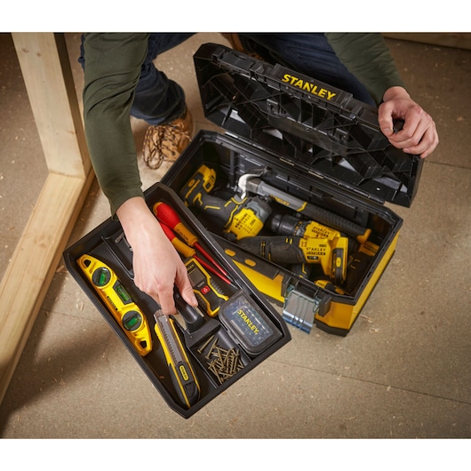 STANLEY 1-95-612 toolbox filled with hand tools and power tools, photography from above.