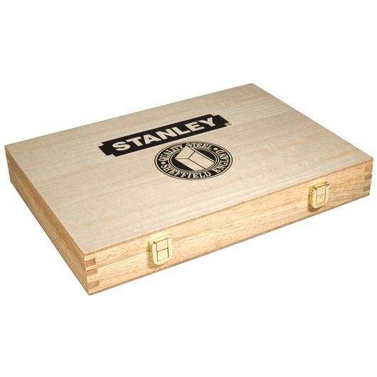 Stanley branded wooden box with gold latches, closed and used for storing tools or photography accessories.