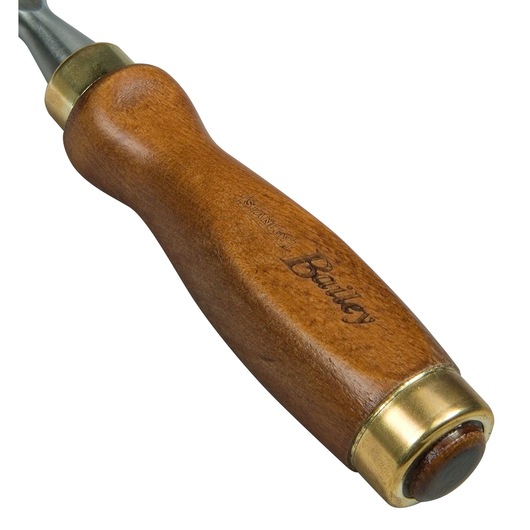 Close-up of a Stanley Bailey wooden handle with brass details, part of a hand tool.