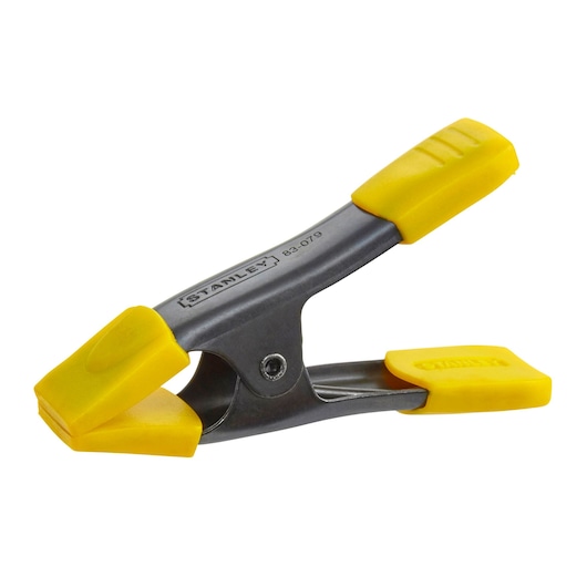 STANLEY 9-83-079 photography of metal spring clamp with yellow handles and jaws, side angle on white background.