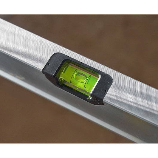 STANLEY FMHT43671-1 spirit level close-up showing green vial on aluminum body.