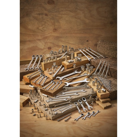 STANLEY FMMT13040-0 assorted wrenches and sockets displayed on wooden blocks, product photography.