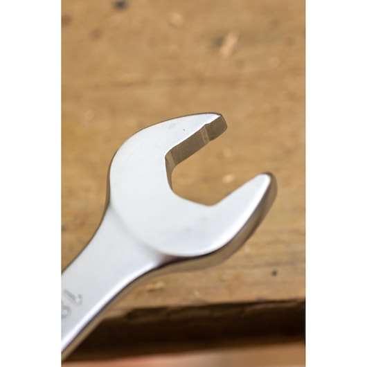 STANLEY FMMT13074-0 open-end wrench photography, silver finish, close-up angled on wood surface.