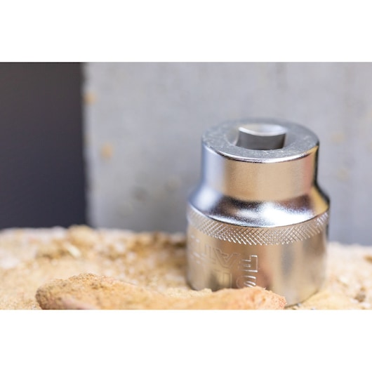 Photo of STANLEY FMMT17211-0 chrome socket tool on a work surface, close-up view.