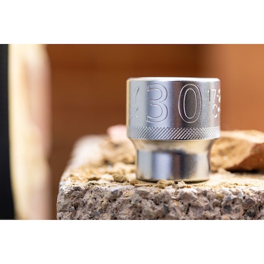 STANLEY FMMT17238-0 socket, silver finish, close-up on stone surface, photography product.