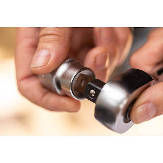 STANLEY FMMT17243-0 socket wrench photography close-up of hand attaching silver socket.
