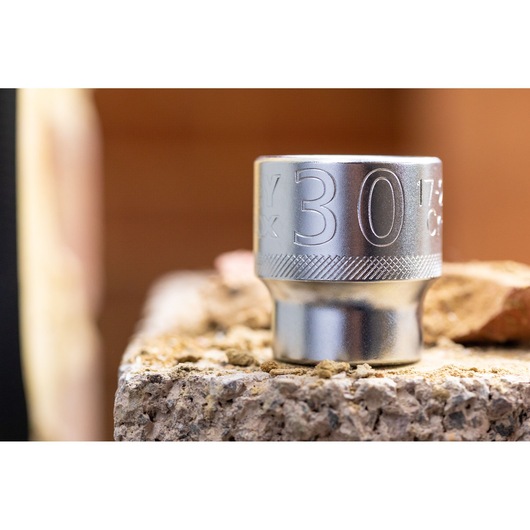 STANLEY FMMT17244-0 socket photography, silver finish, close-up side angle on a rough surface.