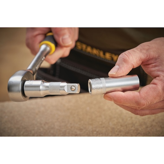 STANLEY FMMT17967-0 socket wrench and socket held in hand in close-up photography.