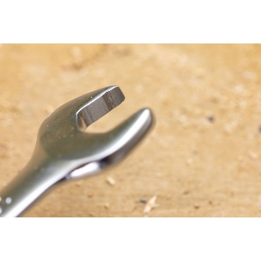 STANLEY FMMT82849-0 open-end wrench close-up, metallic finish, tool on wooden surface.