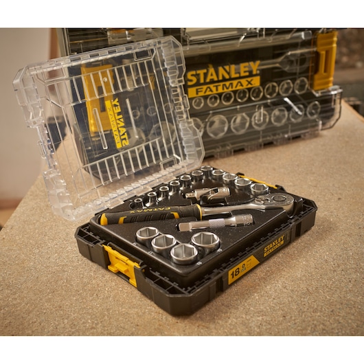 STANLEY FMMT98102-0 socket set with ratchet, screwdriver, and sockets in black and yellow case, angled view.