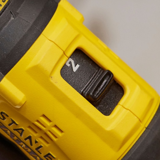 STANLEY SFMCD710D2K yellow and black drill detail, showing close-up of speed selector switch.