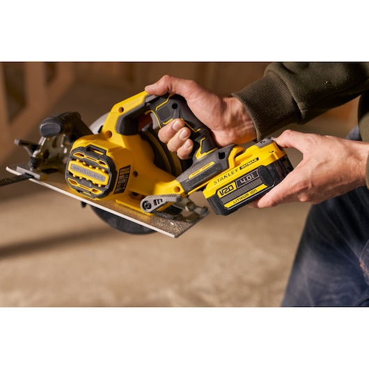 Photo of STANLEY SFMCS550M2K cordless circular saw with brushless motor, V20 lithium-ion battery, in use.