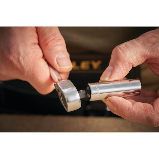 STANLEY STMT86289-0 socket and ratchet in hands, close-up photography.