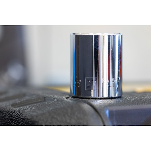 STANLEY STMT86518-0 chrome socket, 27mm size, close-up angle on textured black surface.
