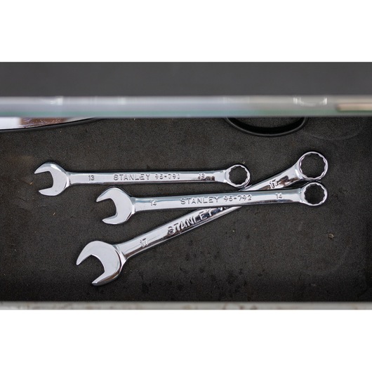 STANLEY STMT95912-0 combination wrenches in three sizes on black drawer, top view, hand tools.