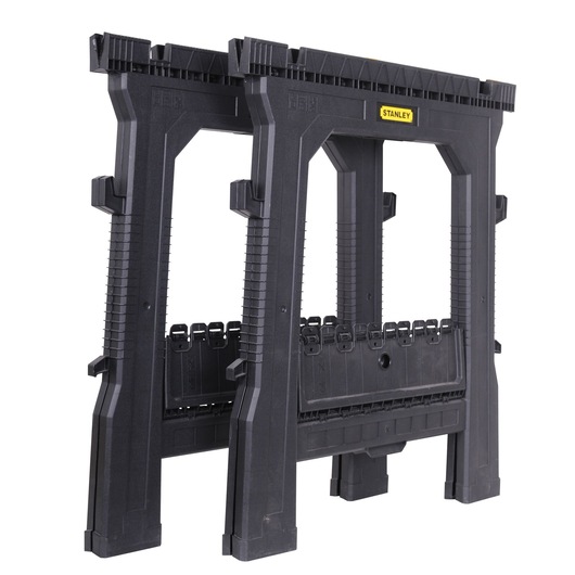 STANLEY STST1-70713 folding plastic sawhorse pair, black, side angle, white background.