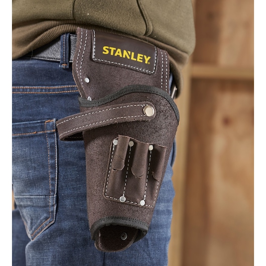STANLEY STST1-80118 leather tool holster on belt, brown with multiple tool slots, close-up side view.