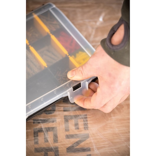 STANLEY STST81680-1 small parts organizer with clear lid, yellow dividers, hand opening latch, angled view.