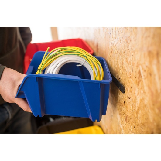 STANLEY STST82740-1 blue storage bin holding coiled wires, photo taken from the side on a wall mount.