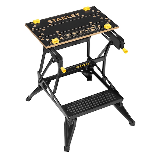 STANLEY STST83400-1 workbench with black frame, wooden top, yellow handles, front angle on white background.